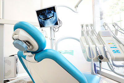 dental chair showing tools and digital imaging