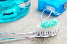 Blue tooth brush with paste, floss, and mouth wash