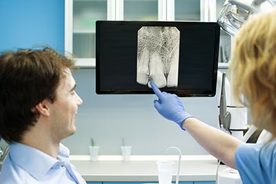 Dentist explaining digital x-ray